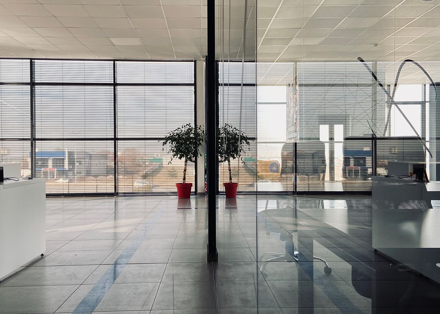 A modern office with glass-walled private spaces